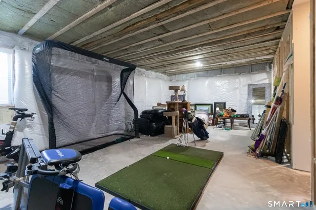 a room with gym equipment and a mirror