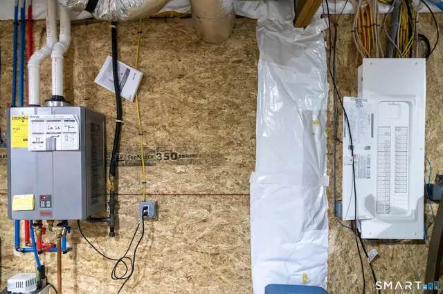a balcony with next to a brick wall
