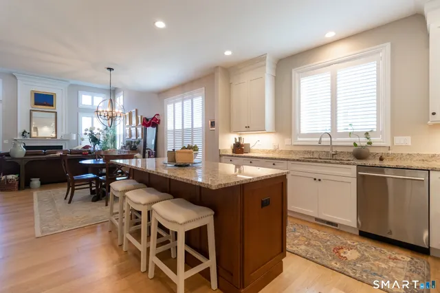 a kitchen with granite countertop lots of counter top space and dining table