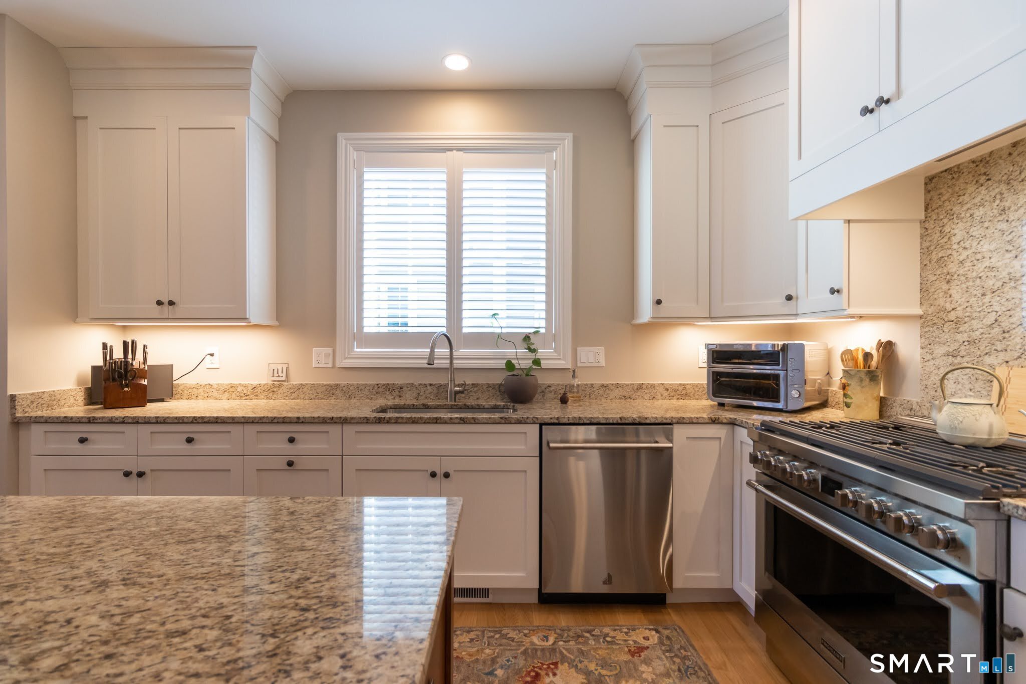 22 Soderman Way Cheshire, CT 06410 - Photo 9 of 40 a kitchen with stainless steel appliances granite countertop a stove a sink dishwasher and a refrigerator