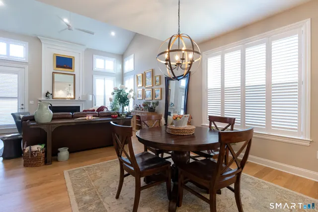 a view of a dining room with furniture window and wooden floor