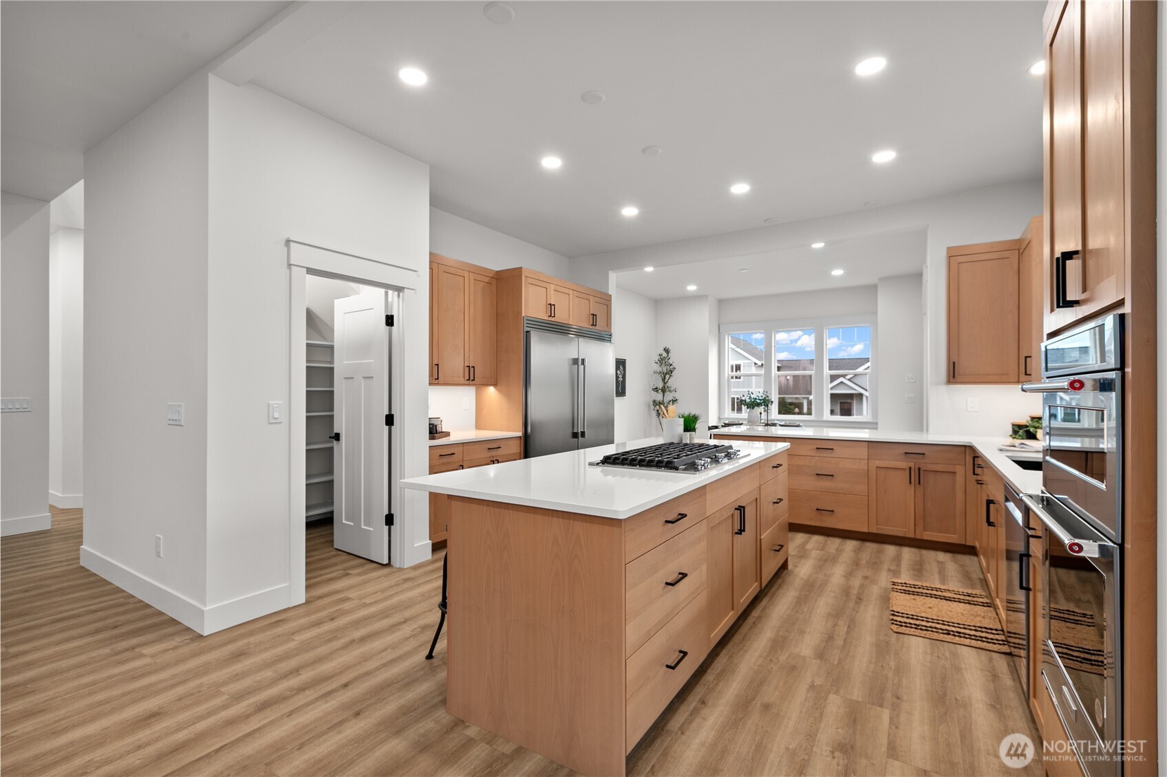 1095 Terrace Drive Lynden, WA 98264 - Photo 11 of 39 a large kitchen with stainless steel appliances granite countertop a large center island and a sink