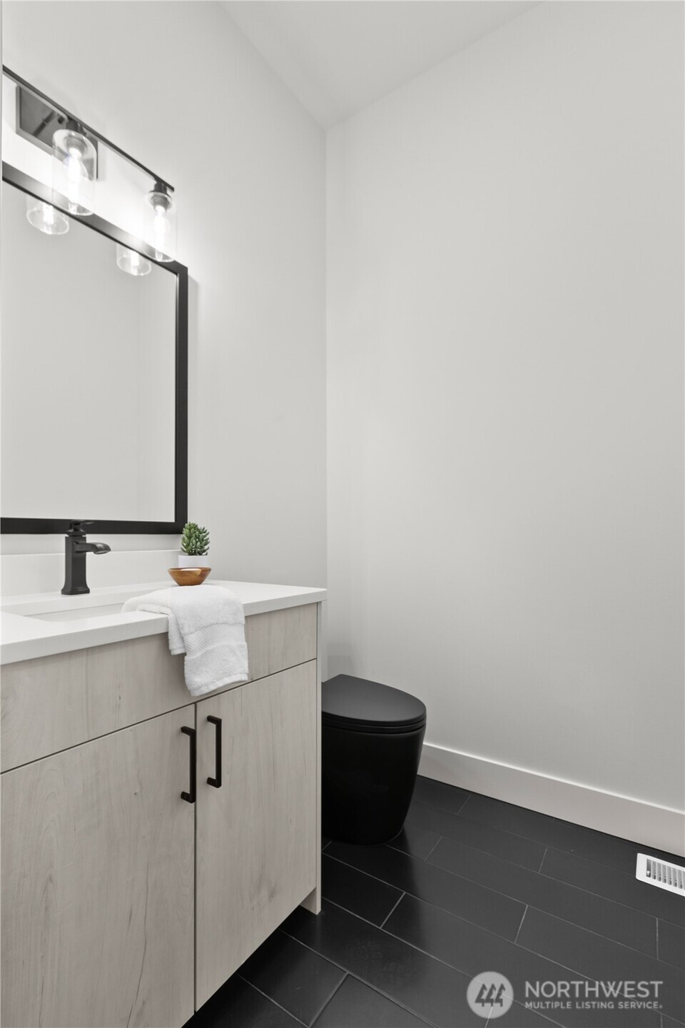 1095 Terrace Drive Lynden, WA 98264 - Photo 18 of 39 a bathroom with a sink a toilet and mirror