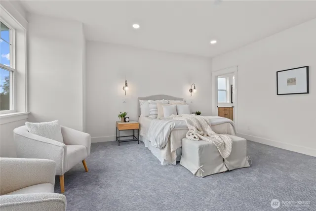 a bedroom with bed and a couch