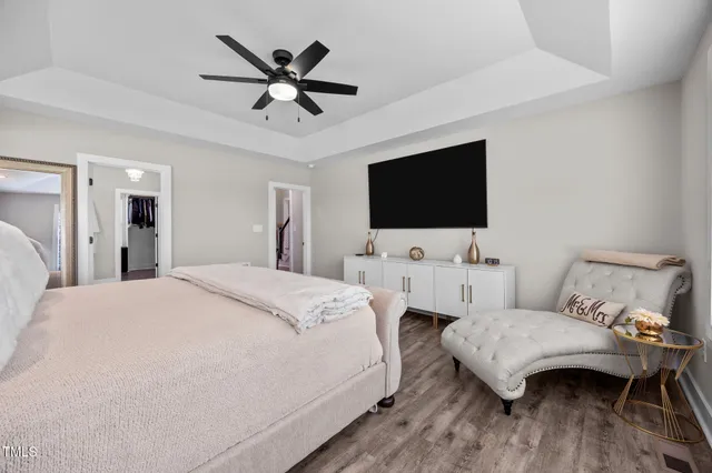 a spacious bathroom with a granite countertop sink mirror and shower