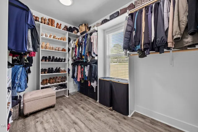 a kitchen with stainless steel appliances granite countertop a sink refrigerator and microwave