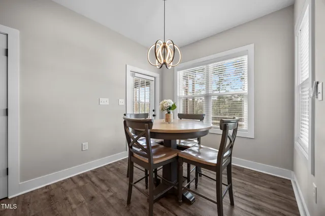 a view of a dining room with furniture window and outside view