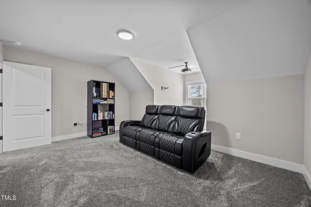 a living room with a couch and a rug