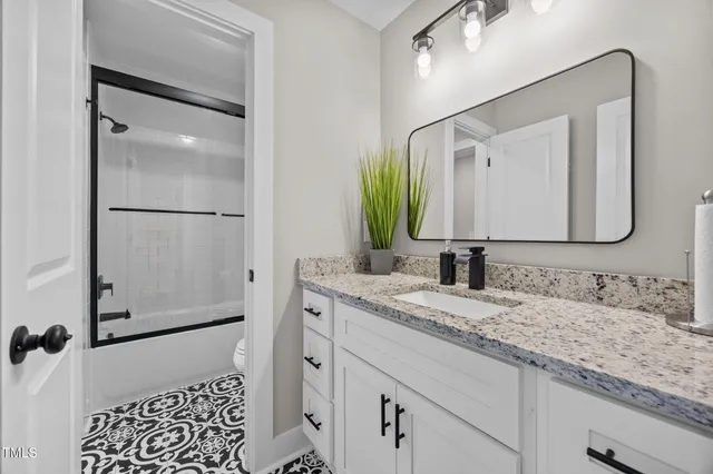 a spacious bedroom with a bed and window