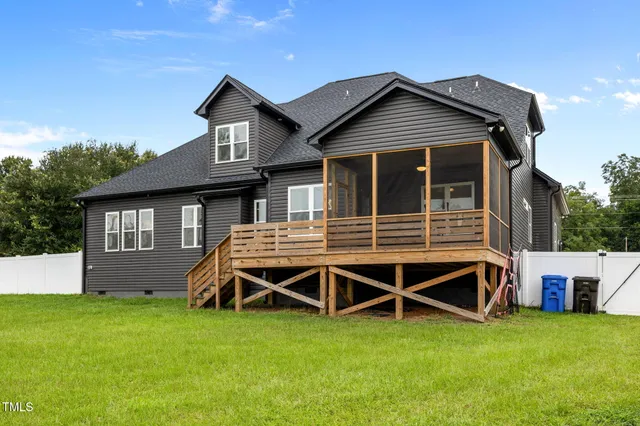 a view of a house with backyard and stairs