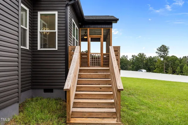a view of a swimming pool with a yard