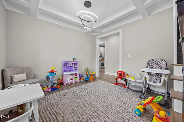 a living room filled with furniture and a window