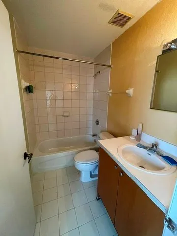 a bedroom with bed and window