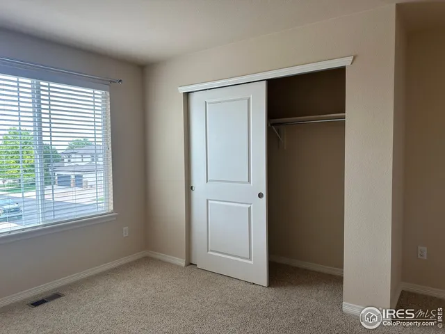 a view of yard from deck having patio