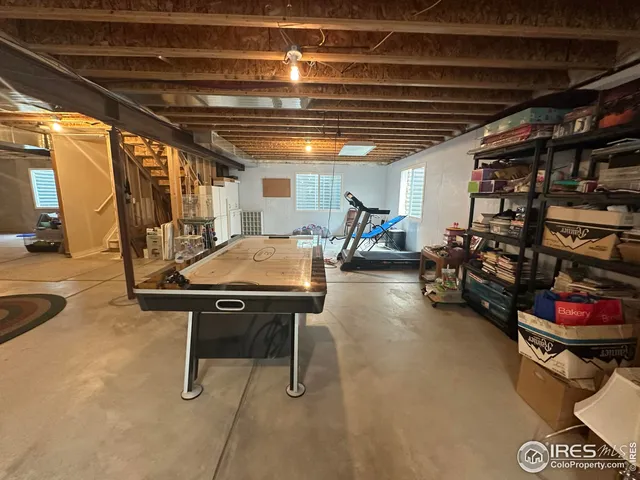 a front view of a house with a garden and plants