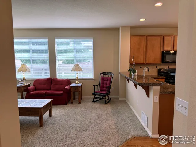 a living room with furniture fireplace and flat screen tv