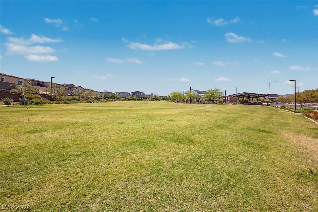 226 Augusta Ridge Henderson, NV 89015 - Photo 37 of 47 Expansive green space offers community recreation with residential views and mountain backdrop.
