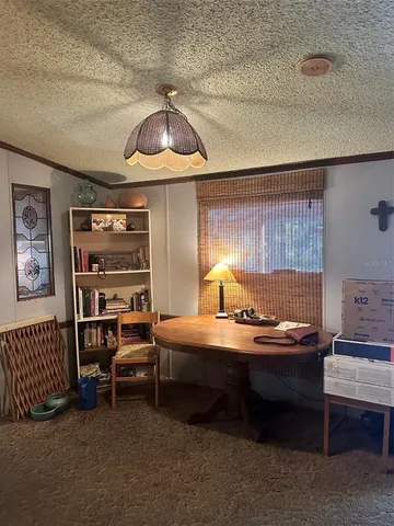 a room with a bed and a chandelier