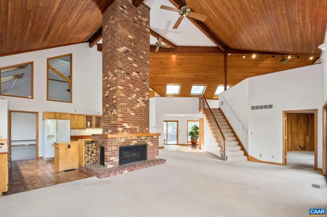 a view of roof with wooden floor and a yard