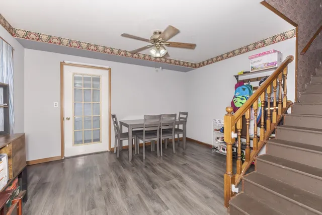a bedroom with a bed and a flat tv screen on dresser