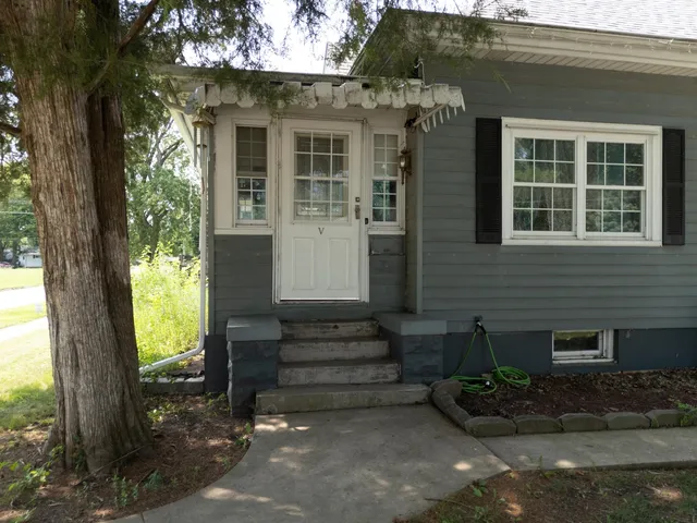 a view of a house with snow on the road