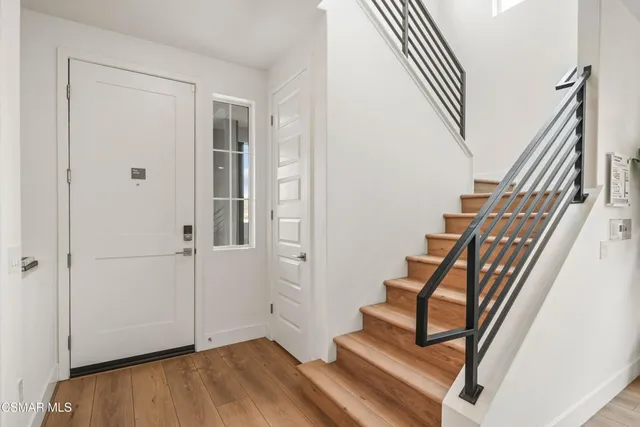 a view of entryway with wooden floor