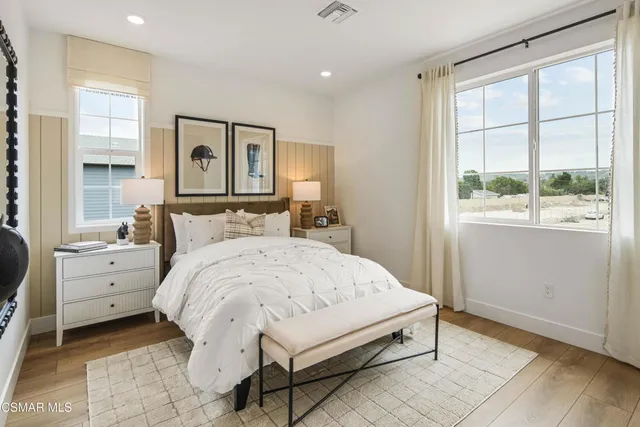 a bed room with a bed and a window