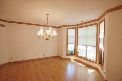 3002 Robinson Road Rockford, IL 61114 - Photo 3 of 13 a view of a livingroom with a chandelier fan and windows