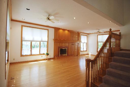 3002 Robinson Road Rockford, IL 61114 - Photo 4 of 13 a view of an empty room with wooden floor and a window