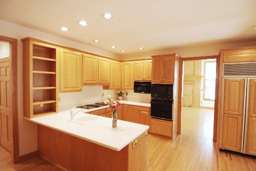 3002 Robinson Road Rockford, IL 61114 - Photo 6 of 13 a kitchen with a sink and a refrigerator