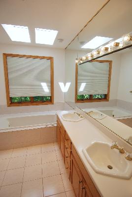 3002 Robinson Road Rockford, IL 61114 - Photo 10 of 13 a bathroom with a sink and a mirror