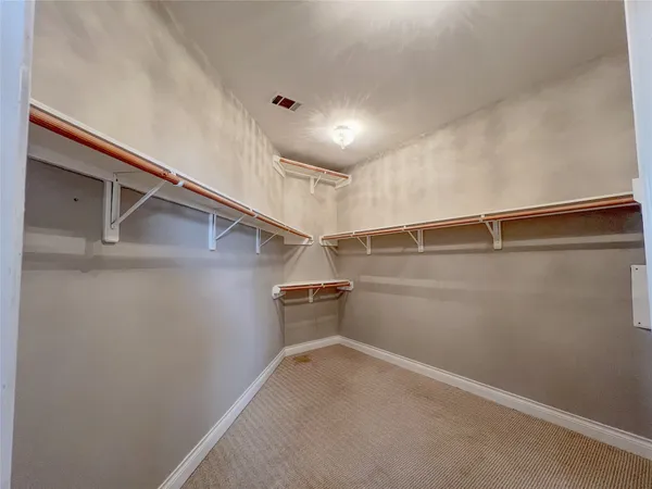 a view of a room with racks on the wall