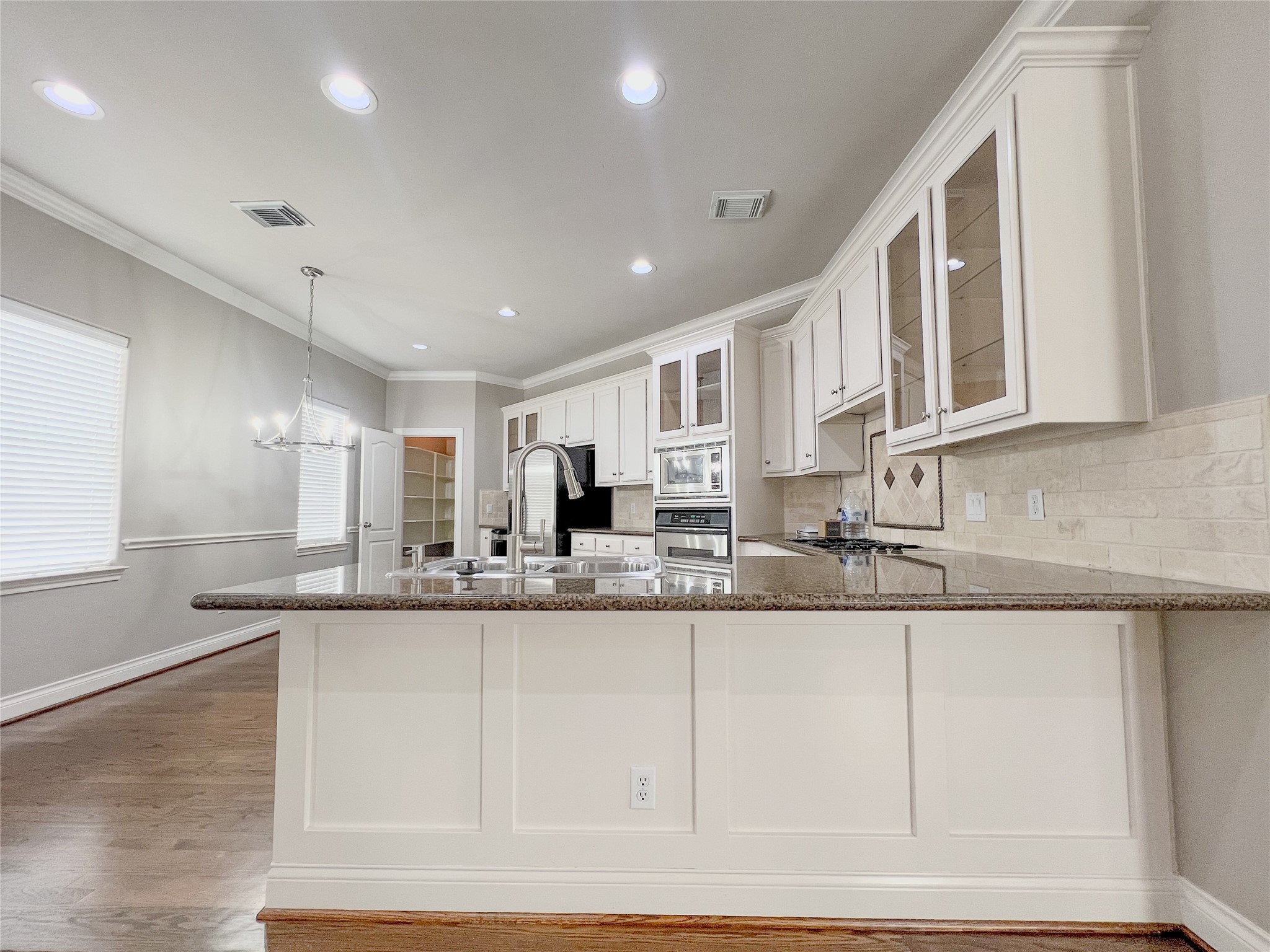 2201 Austin Street Houston, TX 77002 - Photo 20 of 25 a kitchen with stainless steel appliances granite countertop a sink and cabinets