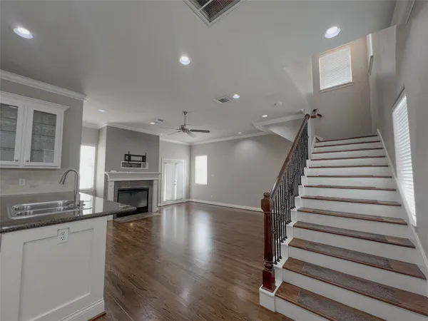 a kitchen with sink microwave and stove