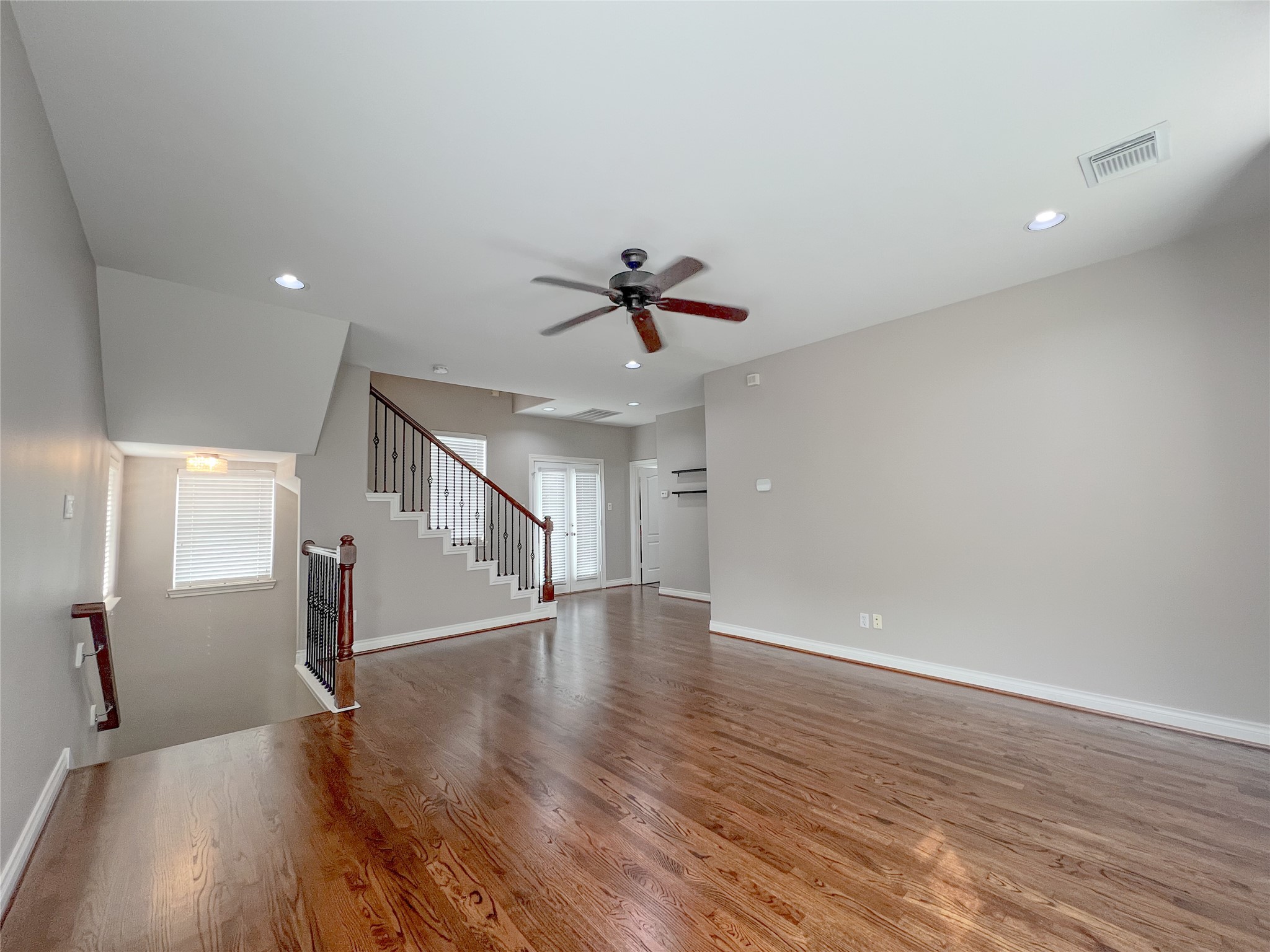 2201 Austin Street Houston, TX 77002 - Photo 25 of 25 a view of an empty room with wooden floor and a ceiling fan