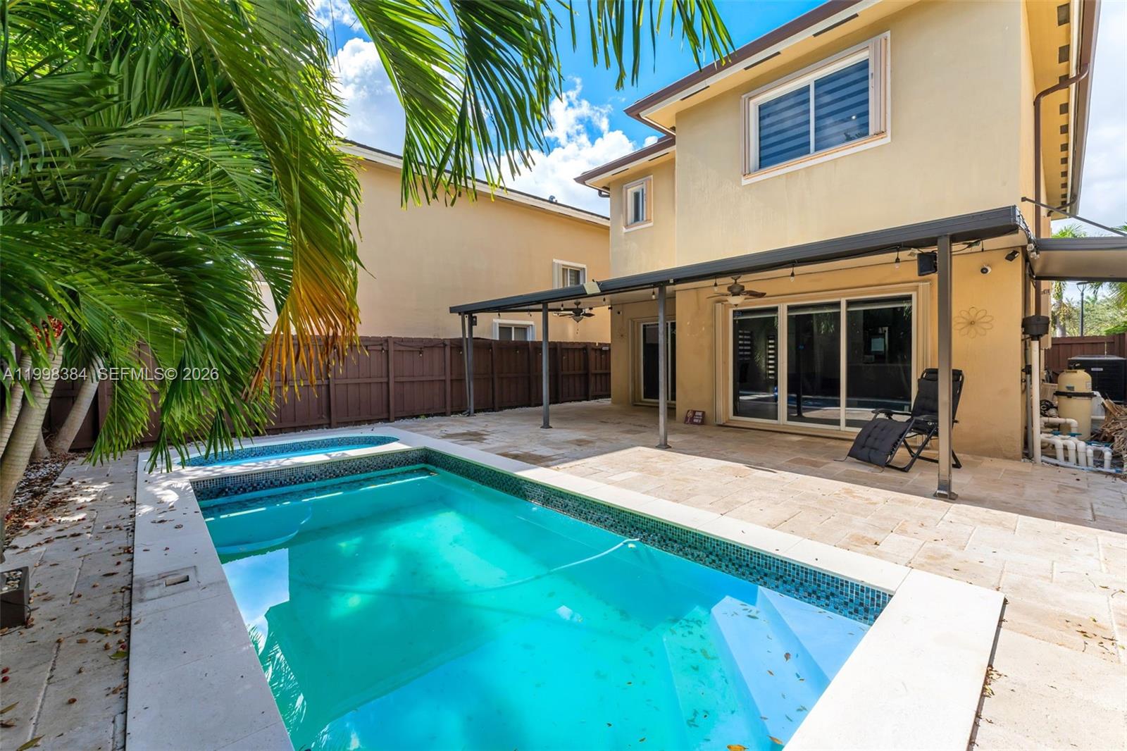 239 Southeast 31st Terrace Homestead, FL 33033 - Photo 19 of 49 a view of a house with a swimming pool and sitting area