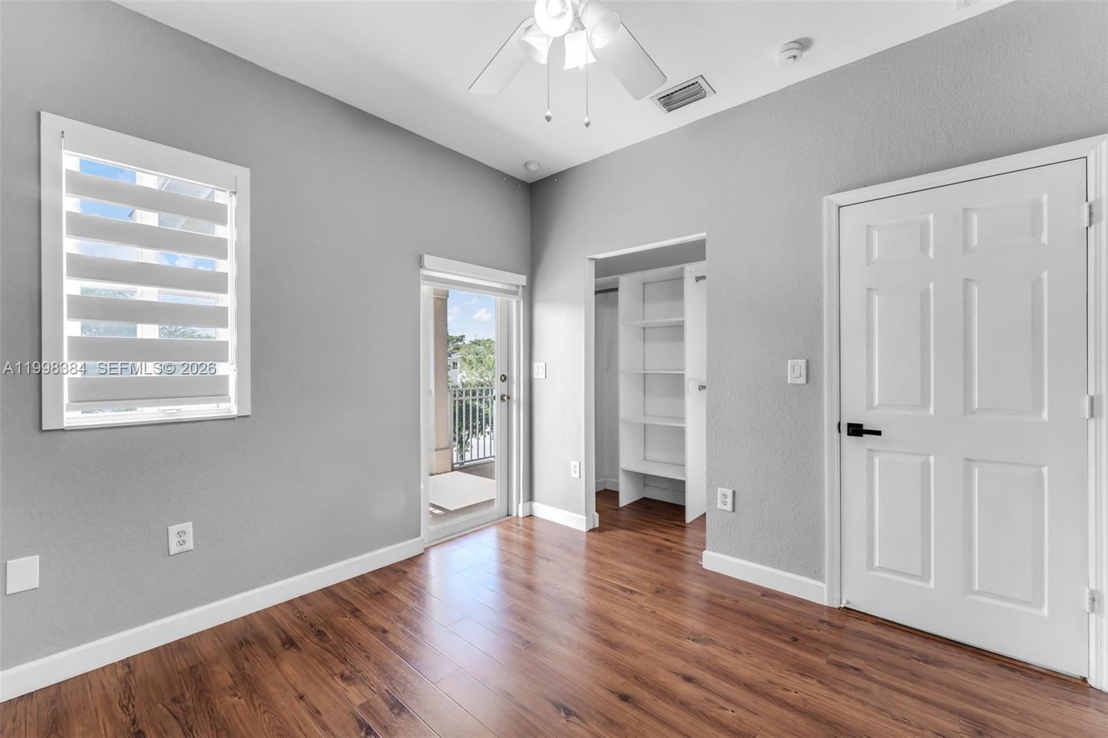 239 Southeast 31st Terrace Homestead, FL 33033 - Photo 27 of 49 wooden floor in an empty room with a window