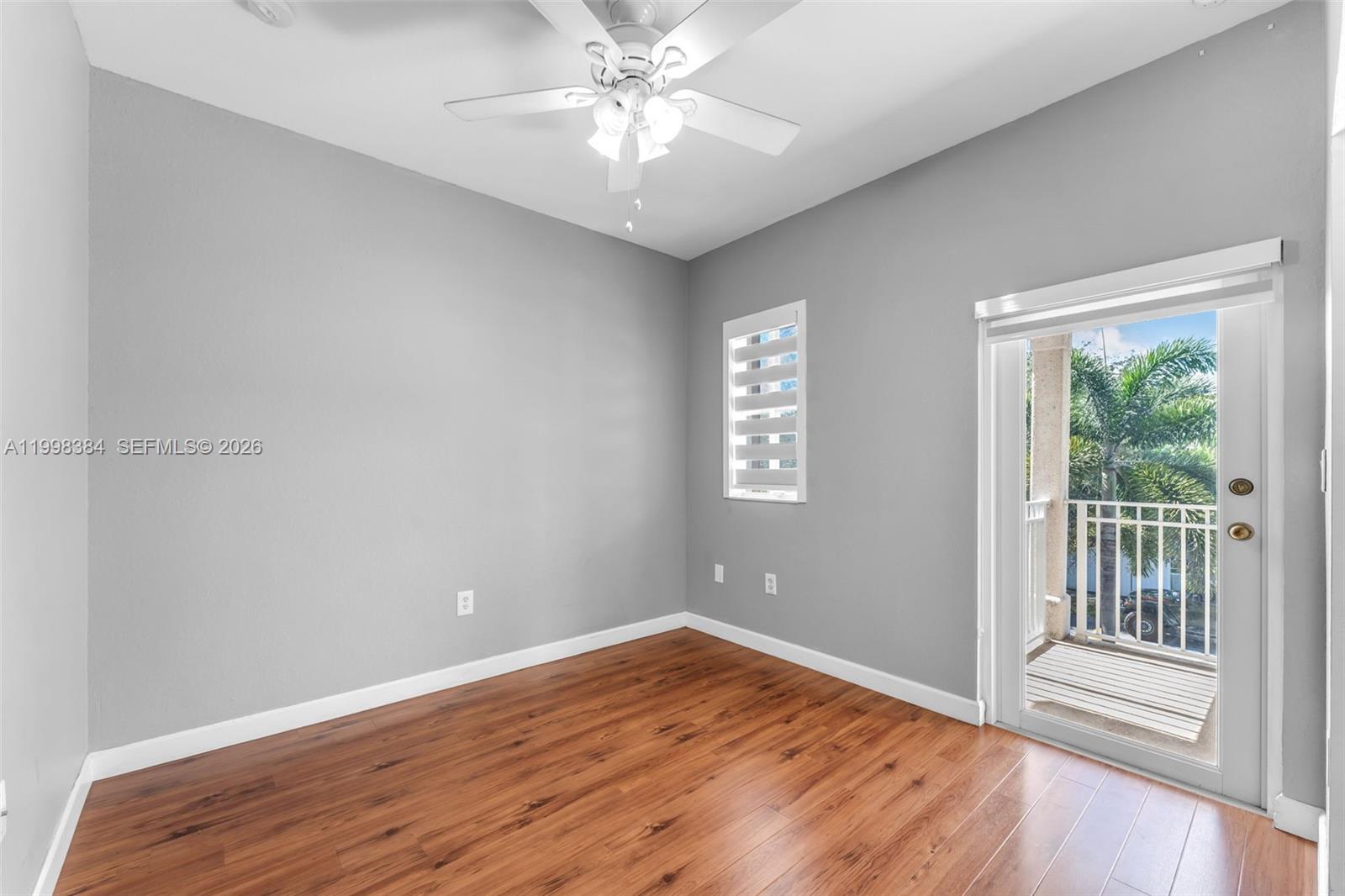 239 Southeast 31st Terrace Homestead, FL 33033 - Photo 28 of 49 wooden floor in an empty room with a window