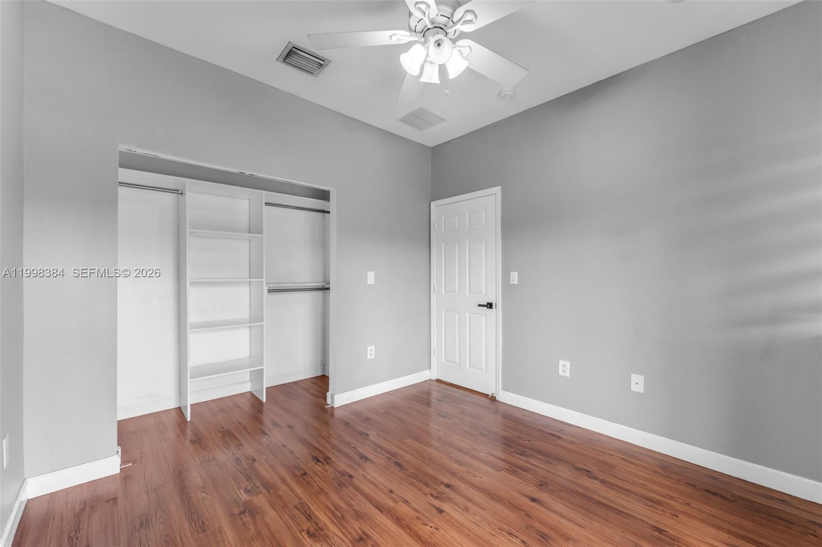 239 Southeast 31st Terrace Homestead, FL 33033 - Photo 29 of 49 a view of an empty room with wooden floor