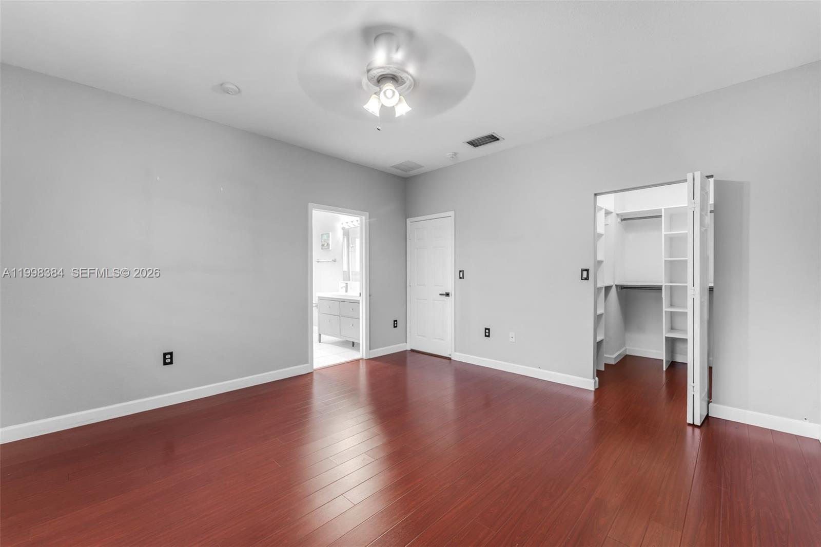 239 Southeast 31st Terrace Homestead, FL 33033 - Photo 31 of 49 wooden floor in an empty room with a window