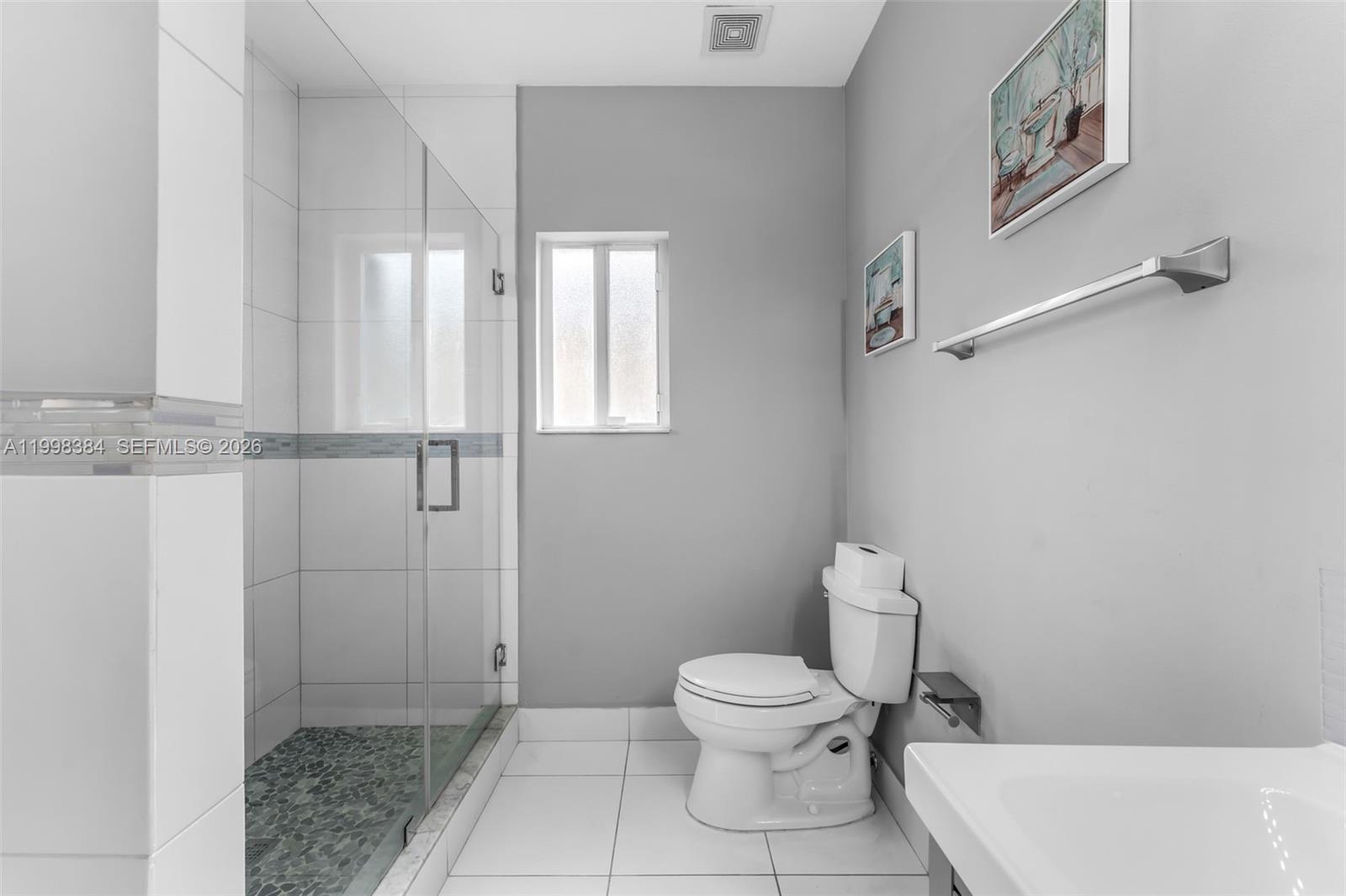 239 Southeast 31st Terrace Homestead, FL 33033 - Photo 33 of 49 a bathroom with a toilet a sink and shower