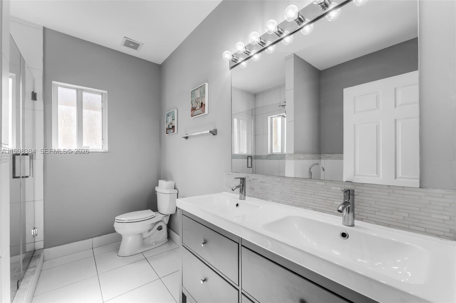 239 Southeast 31st Terrace Homestead, FL 33033 - Photo 34 of 49 a bathroom with a sink and a mirror