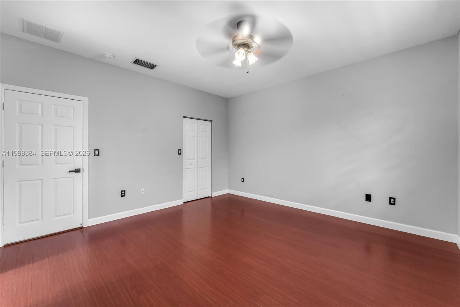 239 Southeast 31st Terrace Homestead, FL 33033 - Photo 36 of 49 wooden floor in an empty room