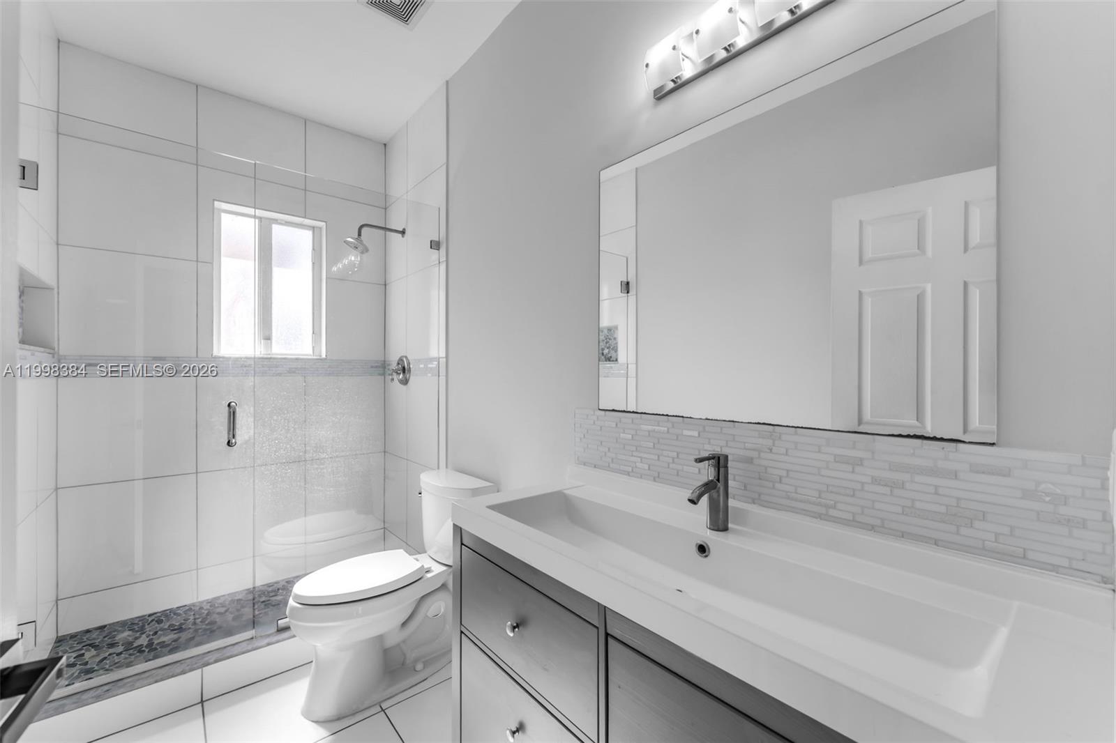 239 Southeast 31st Terrace Homestead, FL 33033 - Photo 40 of 49 a bathroom with a sink a toilet and shower