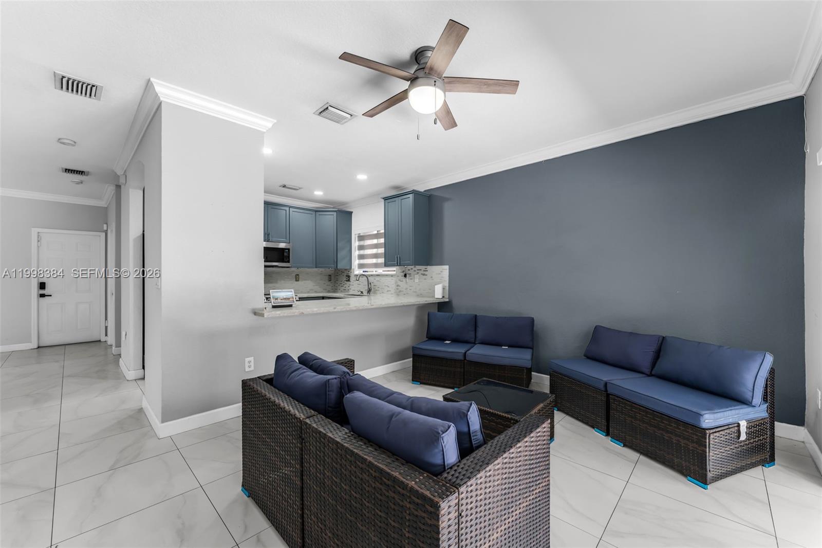 239 Southeast 31st Terrace Homestead, FL 33033 - Photo 45 of 49 a living room with furniture and kitchen view