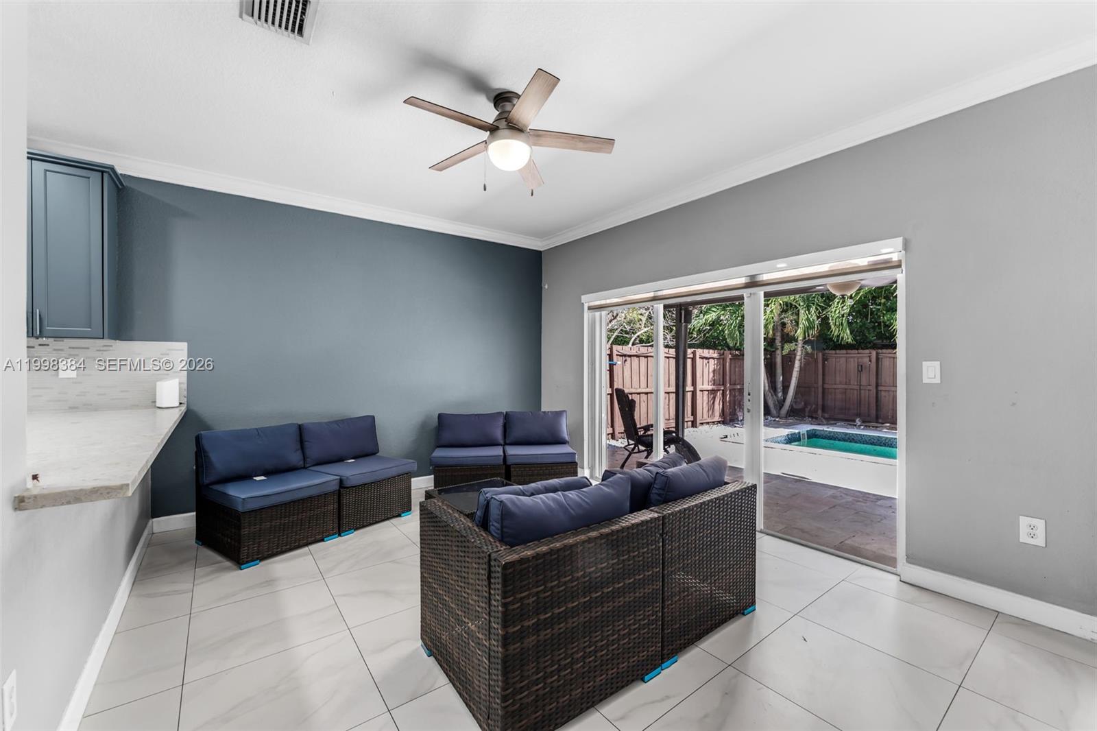 239 Southeast 31st Terrace Homestead, FL 33033 - Photo 46 of 49 a living room with furniture and a large window