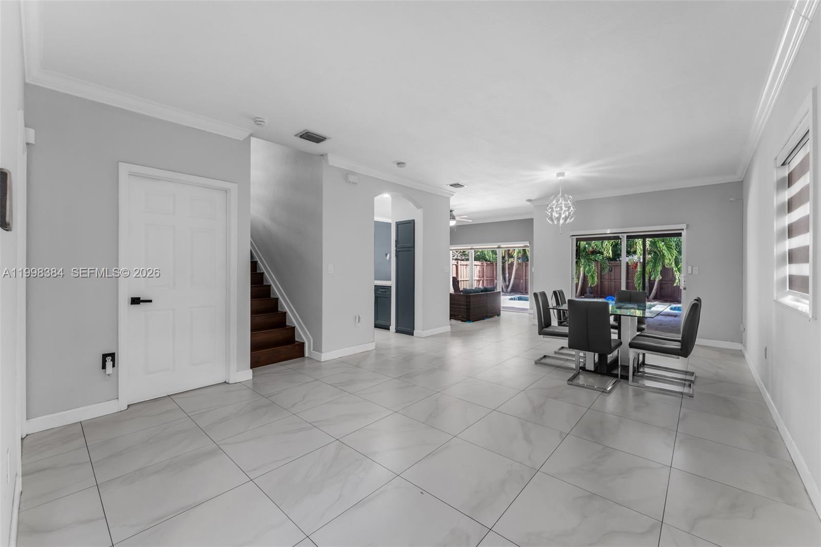 239 Southeast 31st Terrace Homestead, FL 33033 - Photo 47 of 49 a living room with furniture and a window