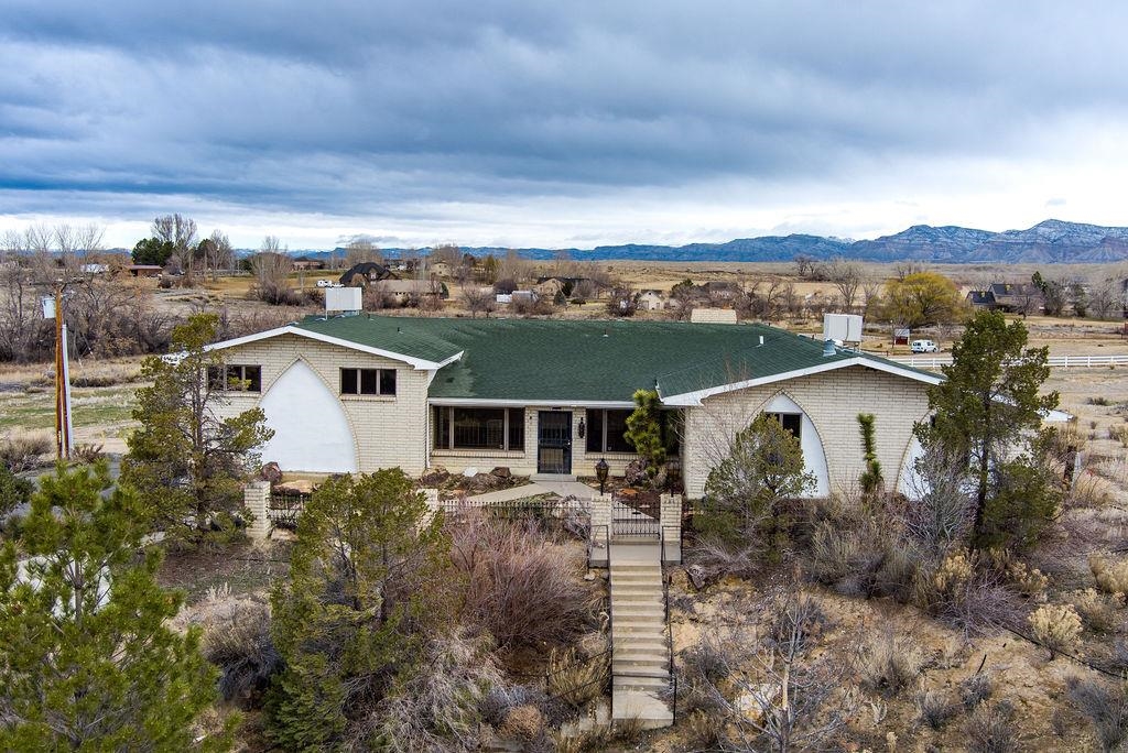 2590 I Road Grand Junction, CO 81505 - Photo 1 of 41 an aerial view of a house with a yard table and chairs