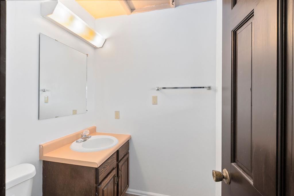 2590 I Road Grand Junction, CO 81505 - Photo 16 of 41 a bathroom with a sink toilet and vanity