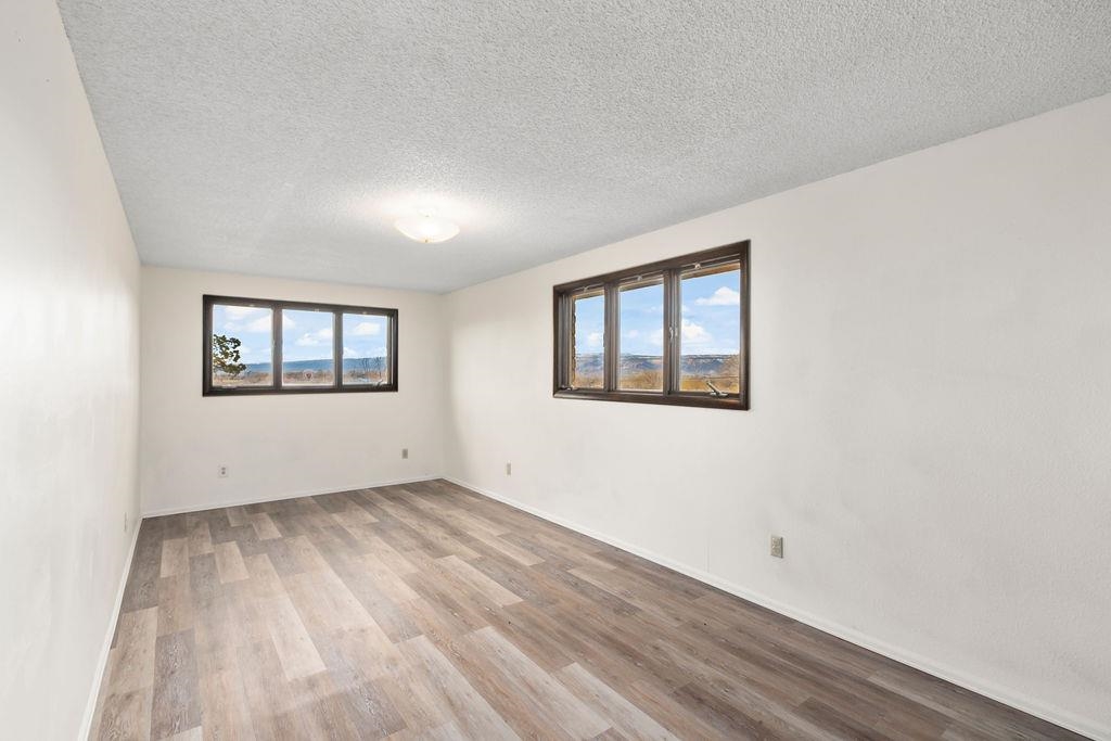 2590 I Road Grand Junction, CO 81505 - Photo 17 of 41 a view of an empty room with wooden floor and a window